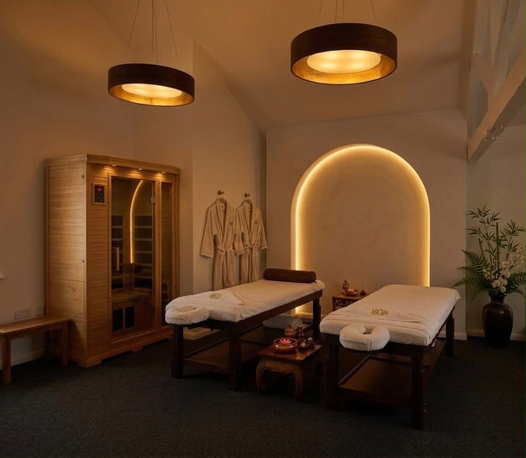 Warmly lit massage treatment room